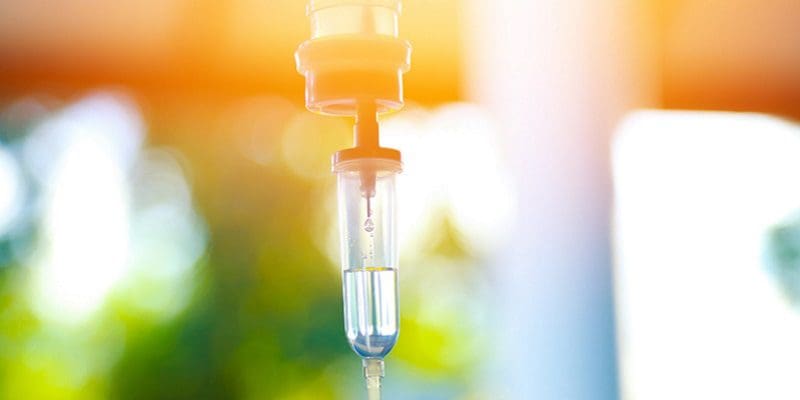Set iv fluid intravenous drop saline drip hospital room,Medical Concept,treatment emergency and injection drug infusion care chemotherapy, concept.blue light background,selective focus IV Therapy