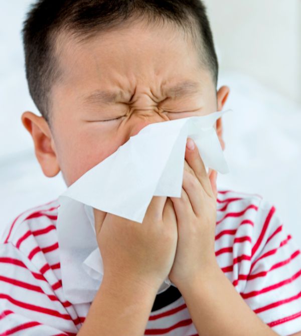 Kid blowing nose