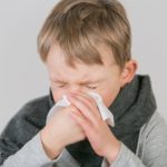 Kid blowing nose