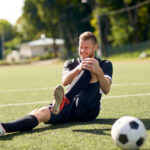 injured soccer player with ball