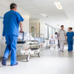 Doctors and Nurse in Urgent Care Hospital Corridor