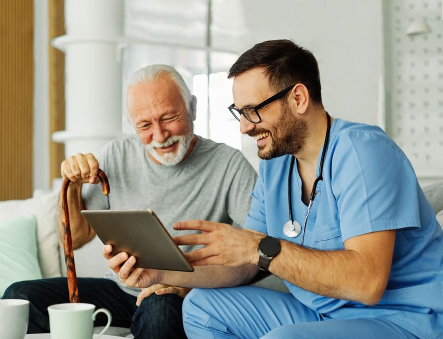 Hillsboro nurse with senior patient discussing medical care
