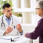 Doctor talking with patient